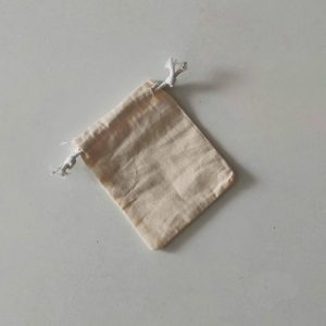 Cotton microphone dust cover with drawstring in light beige linen color on white background