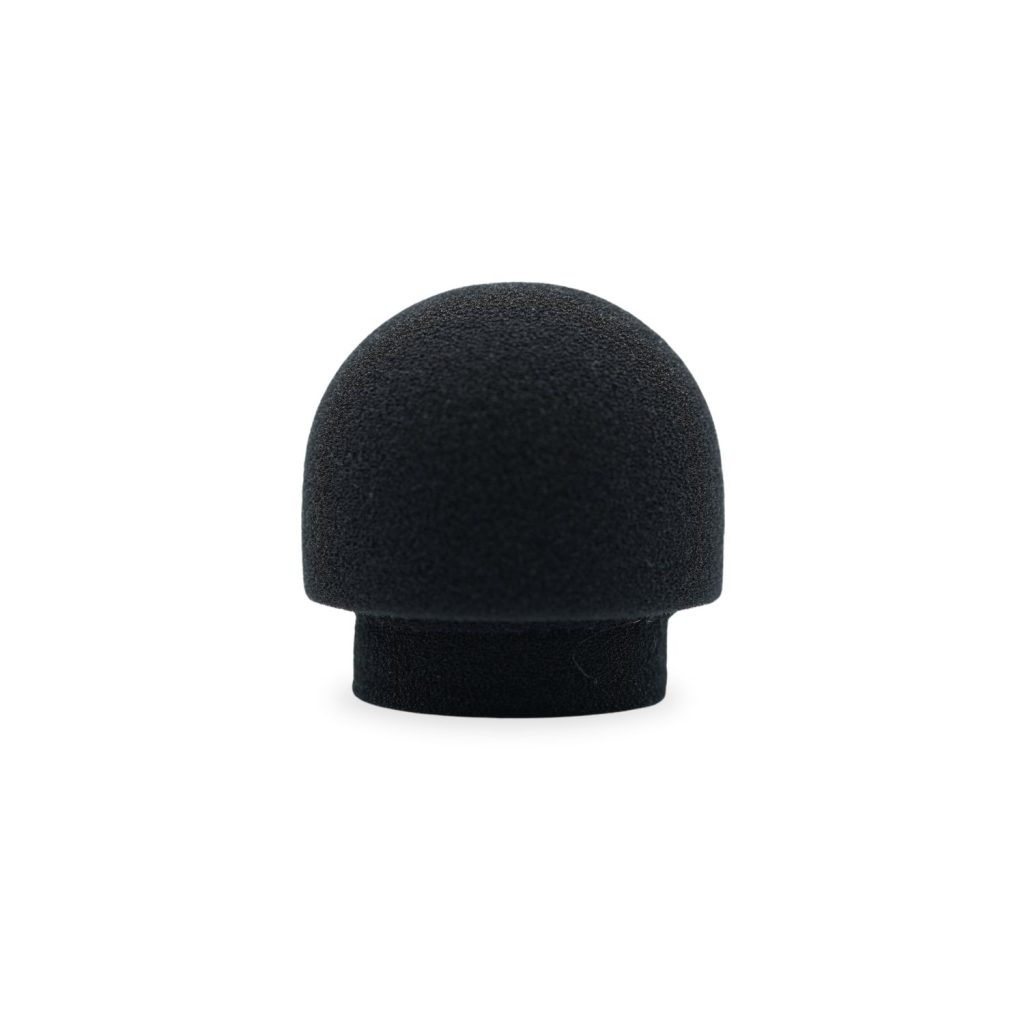 Close-up view of mushroom-shaped foam windscreen showing expanded capsule coverage