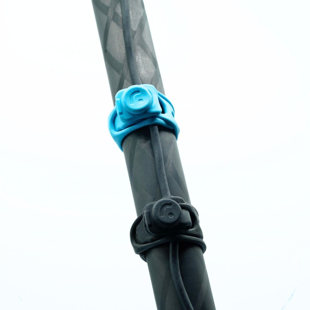 Close-up view of RAD cable strap attached to audio cable showing secure fit