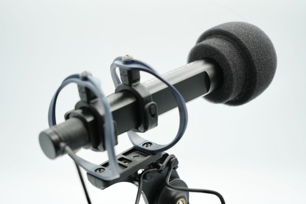 MKH50 mushroom foam windshield positioned for professional microphone protection