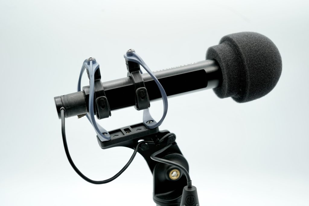 Mushroom foam windshield demonstrating fit and coverage for professional microphones