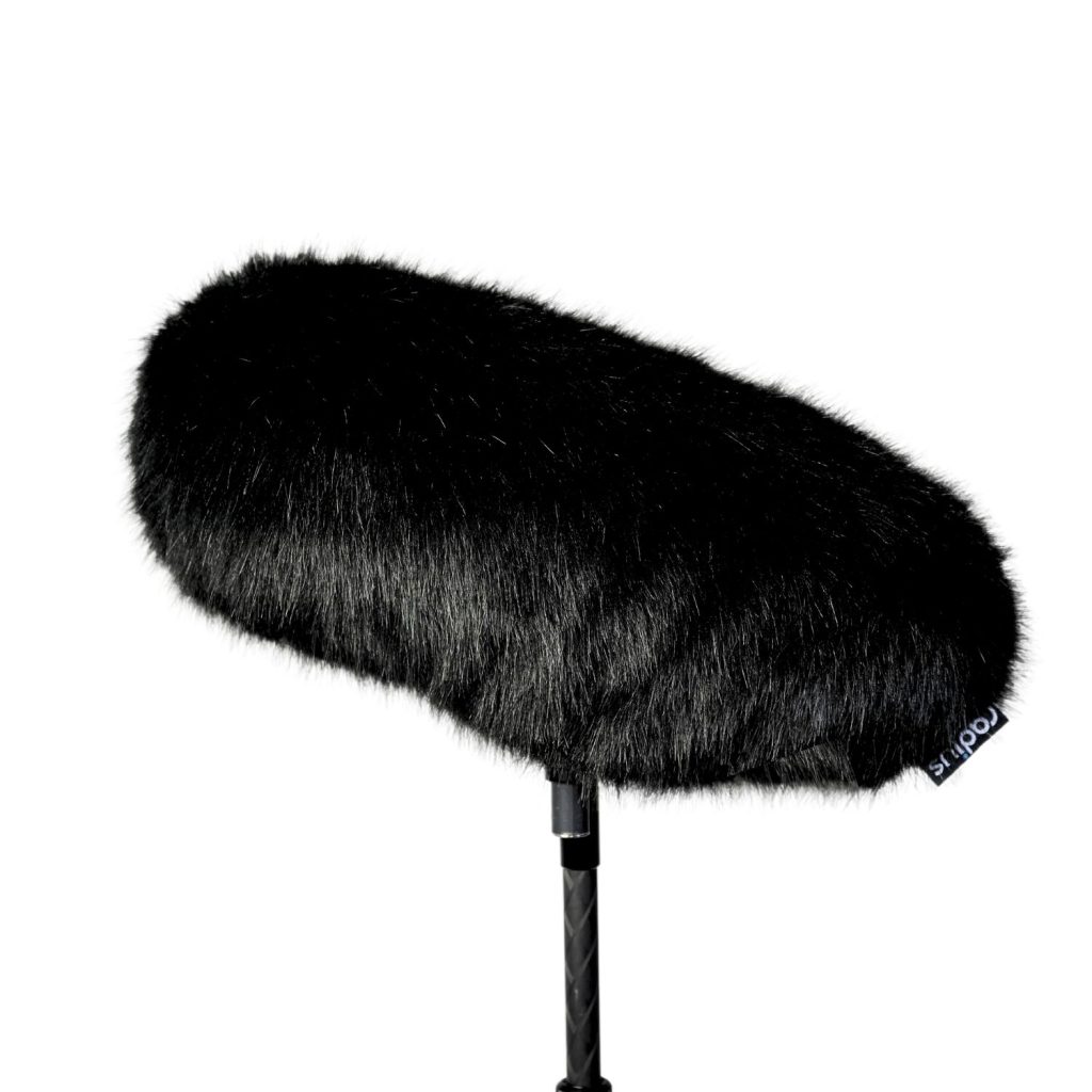 Close-up view of multi-pile black acoustic fur windcover construction and internal lining