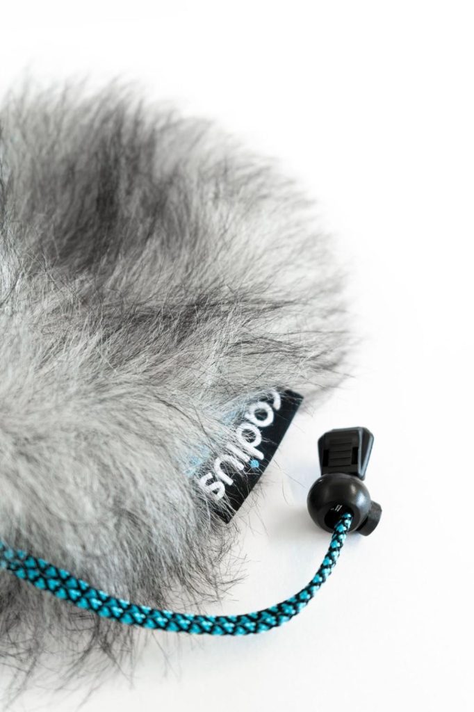Close-up view of long-pile acoustic fur texture and internal lining construction